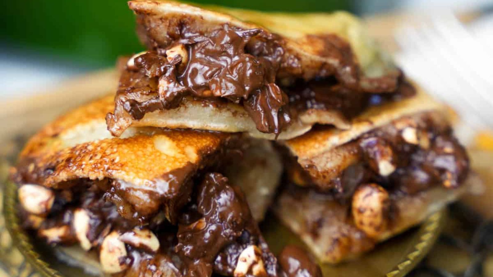 Thick Indonesian Chocolate Peanut Pancake slices on a plate.