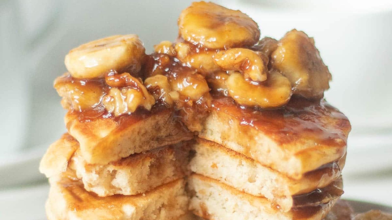 Banana Foster Pancakes with bananas on top.