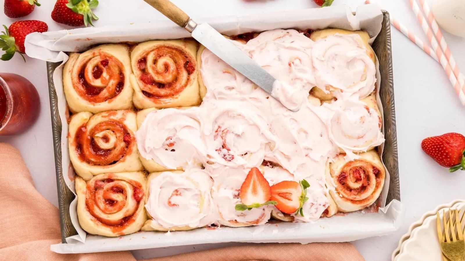 Strawberry Cinnamon Rolls in a baking pan.